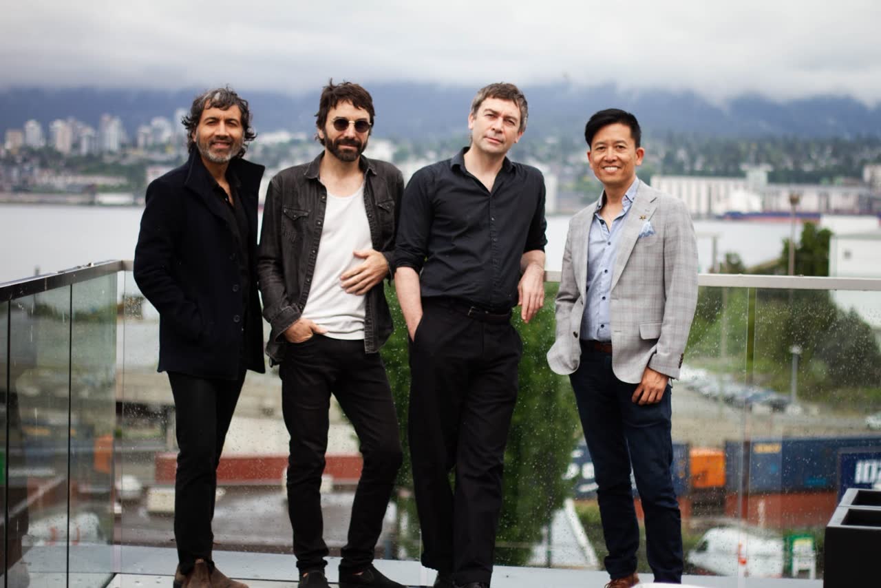 The Feels Good Media team with a client overlooking the North Vancouver waterfront